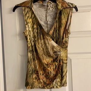 A sleeveless top in earth tones.